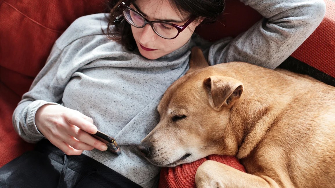 Woman on couch with dog