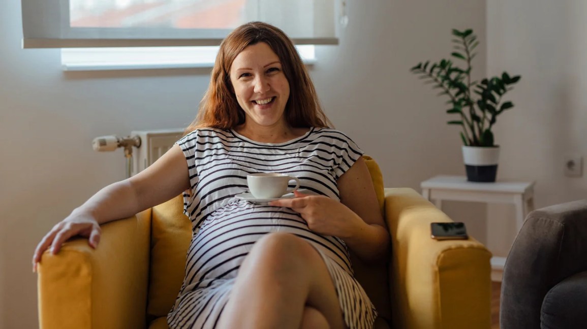 Pregnant woman sitting in chair