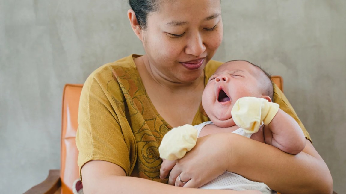 parent holds new baby